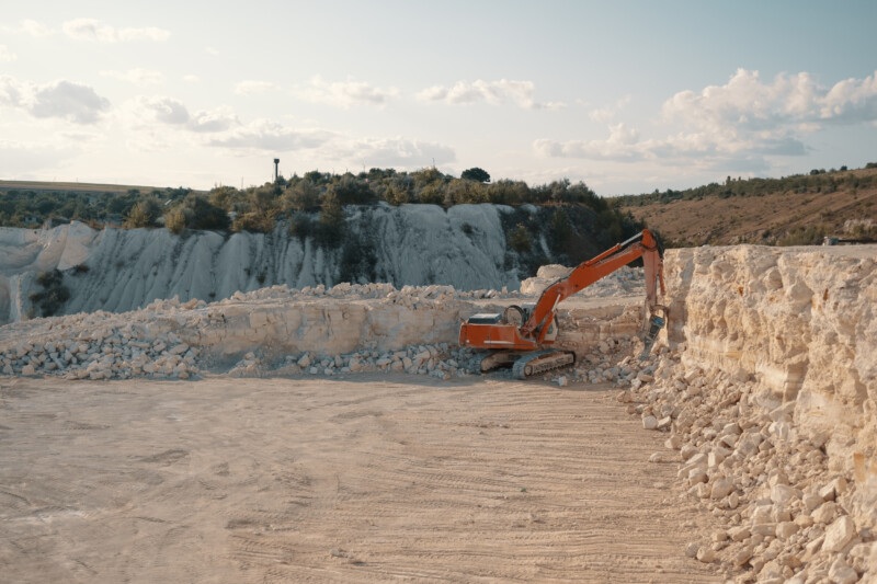 Heavy machinery in quarry. Building materials mining